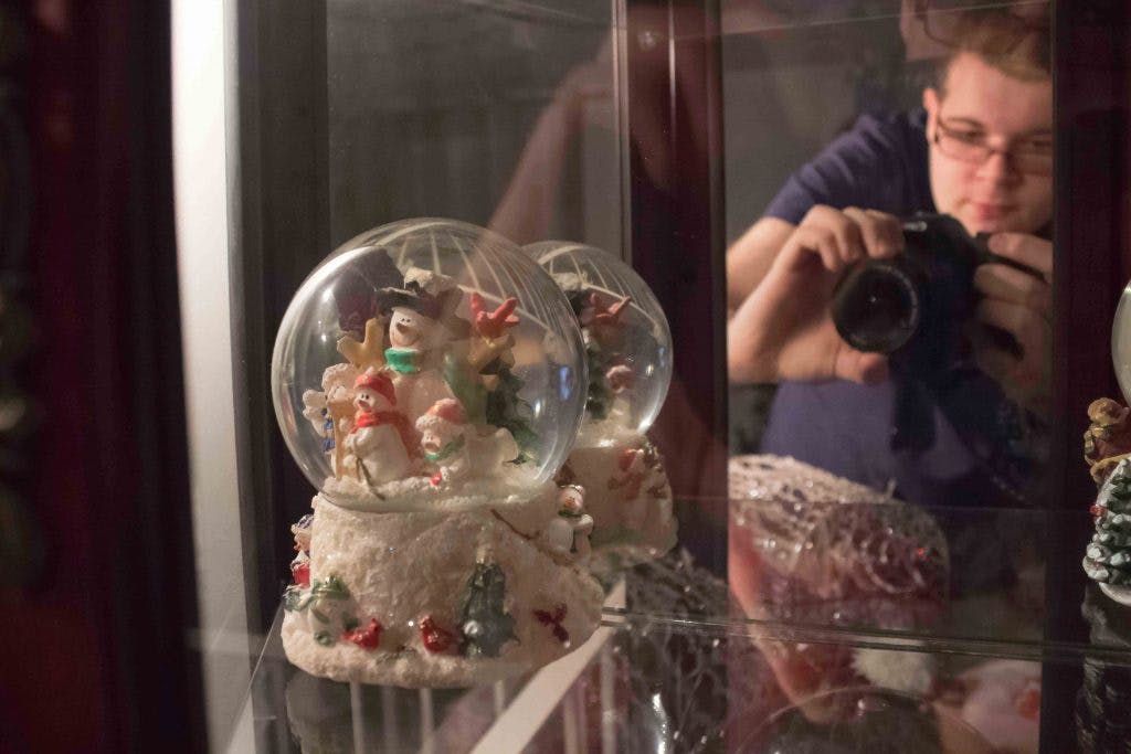 Donald taking picture of snow globe